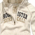 A static image of a light-colored hoodie with 'ASTRO GOLF' text on the chest, displayed in four identical