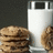 A pixelated image shows a glass of milk and cookies with text asking why one should eat real food.