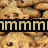 A pixelated image of multiple cookies with a black banner displaying partial text reading 'mm:cookies' in yellow letters.
