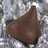 Brown conical object on silver foil background with black text reading 'IM training for the "SPECIAL" olympics !!'