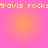 Pixelated yellow text 'travis rocks' repeats across a pink-to-orange gradient background with four circular light spots.