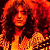 A 2x2 contact sheet of a pixelated animated icon featuring Jimmy Page with long curly hair, orange-yellow lighting, and blue sky background across four frames showing slight pose changes.