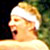 Pixelated close-up of a person's face with light-colored hair and a white headband against a dark background.