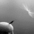Black-and-white pixelated image showing a partial view of a rounded object with a small protrusion on the left, and text fragments 'Make', 'a', and 'Wish' in a stylized font on the right.