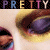 A static image shows a close-up of two eyes with brown and purple irises, above the word "PRETTY" in stylized block letters.