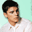 Static pixelated icon of a person with short dark hair wearing a white collared shirt against a light teal background.