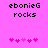Pixelated text 'ebonieG rocks' on bright pink background with two of pink heart icons, one animated to shift left-right