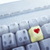 A pixelated image shows a light blue mechanical structure with a yellow and white rounded element featuring a red heart symbol on the right side.
