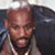 Static pixelated image of a person's face with visible facial features and partial clothing, displayed as a 50x50 buddy icon on a gray background.