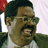 Static 48x48 pixel buddy icon showing a close-up of a person with dark hair, glasses, and an open mouth expression against a light background.
