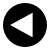 Black circular icon with white border containing white left-pointing triangle on black background.