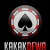 A circular icon with a black spade symbol at center, surrounded by red and white pixelated border on dark background.