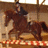 Pixelated image of a rider on a brown horse in mid-gallop, with pink text reading "Fly, pony! Fly!!!" on a black background.