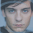 Static 48x48 pixel icon showing a close-up of a person's face with dark hair and light skin, rendered in low-resolution pixel art style against a blue background.
