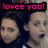 Two pixelated faces under pink text reading 'lovee yoo!' on a dark background.