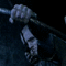 A sequence of showing a character holding a staff, transitioning from a downward to an upward pose with visible facial expressions