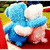 Blue and pink plush toys embrace on a red surface with green background, text reads Best Friends Forever in pixelated font.