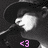 A black-and-white animated icon shows a person in a wide-brimmed hat singing into a microphone, with changing text overlays.