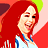 Pixelated image of a woman with long red hair and a blue-and-white top, next to a white car with racing stripes.