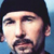 Pixelated static icon of a person's face with dark hair and beard against blue background, rendered in low-resolution style typical of early 2000s instant messaging platforms.