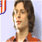Pixelated image of a person in an orange shirt with the word MIRACLE on the right side against a light background.