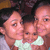 Three people in a close-up pose with light skin tones, dark hair, and one wearing a white top.