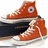 Pixelated orange fish with large eye and white mouth, wearing dark blue pants and white shoes, positioned on white surface.