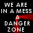 Black background with white pixelated text repeating 'WE ARE IN A MESS' and 'DANGER ZONE', framed by a red, blurred rectangular outline.