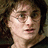 Pixelated close-up of a person with light skin tone, dark hair, and visible facial features including eyes, nose, and mouth, set against a dark background.