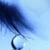 A pixelated blue-toned image shows a dark curved shape extending from the top-left toward a circular light area against a gradient background.