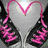 A heart-shaped icon with pink text on black fabric, a hand holding a small pink heart, and hands forming a heart shape.