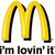 Yellow McDonald's 'M' logo with black outline appears in three positions above text reading "I'm lovin' it" on white background.