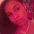 Pixelated close-up of a person's face with closed eyes, rendered in red and pink tones against a dark background.