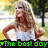 A pixelated image of a woman with long blonde hair in a white top, standing outdoors with hands on hips and green text reading "The best day" at the bottom.