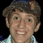 A static image divided into four quadrants with a pixelated portrait on the top-left and text in blue on the top-right and bottom-left