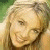 A split-frame contact sheet showing a pixelated image of a smiling woman with blonde hair on the left and green text reading "Original Icons .com" on a dark green background on the right.