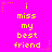 Bright pink background with yellow pixelated text reading "i miss my best friend" arranged in a pattern, surrounded by small orange and pink star shapes