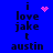 Blue background with black pixelated text reading "i love jake t austin" and pink pixelated heart or star symbols in different positions.