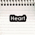 Pixelated black-and-white icon set on lined notebook paper background with 'Heart' and 'Hand' text labels, a folder symbol, and spiral binding details.