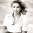Static grayscale icon of a person with long hair wearing a white top, rendered in low-resolution pixel art style against a light background.