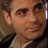 Pixelated close-up of a person's face with visible facial features and clothing, displayed as a static buddy icon.