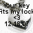 Pixelated black text on white background reads 'your key fits my lock' with a small number 43 and date 12.18.07 below, surrounded by gray smudged shapes.