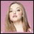 A static image shows a person with long blonde hair against a pink background, with the words DUMB and BLONDE in pixelated text on black