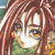 Pixelated close-up of a character with long brown hair, dark eyes, and a green garment, set against a blurred background.