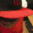 A split-screen image with a red and black hat on the top-left, a blue star logo on the top-right, and a grayscale face below.