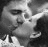 A 3x3 contact sheet of black-and-white animated frames showing a couple kissing with overlaid text changing across frames.