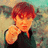 A person with brown hair points directly at the viewer in a pixelated image, with one frame showing bold text overlay.