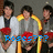 Group of people holding red flowers with yellow accents, text overlays change from 'Roses??? For me??' to 'I luv you guys!!'