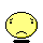 Pixelated yellow circular face with black eyes and downturned mouth, three variations showing subtle differences in eye shape and position.