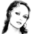 Pixelated grayscale image of a person with long dark hair, wearing a headset with a microphone, facing slightly right.